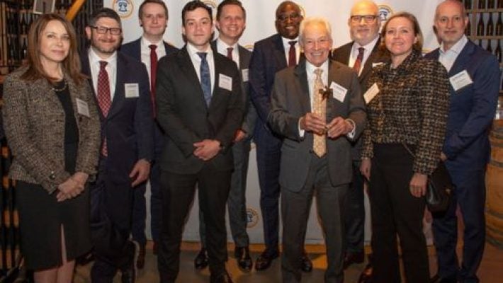 Alan M. Feldman with team