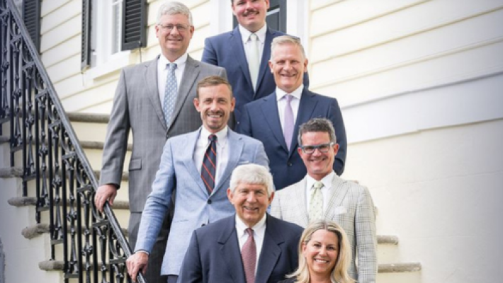 Allan P. Sloan with team