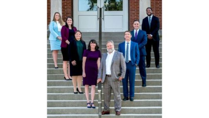 Andrew J. Baldwin with team
