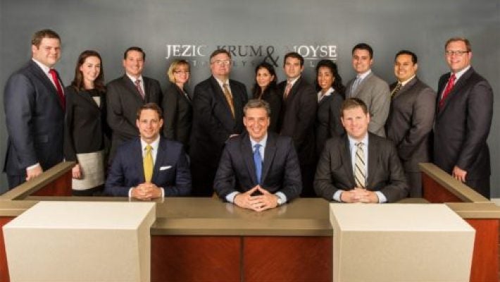 Andrew V. Jezic with team