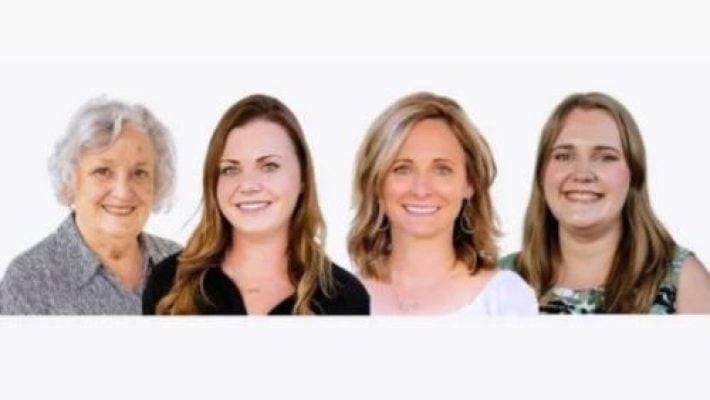 Annette P. Heller with team