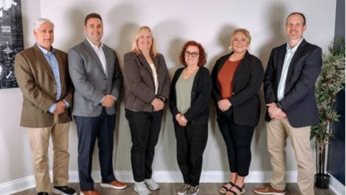 Becky J. Brooks with team