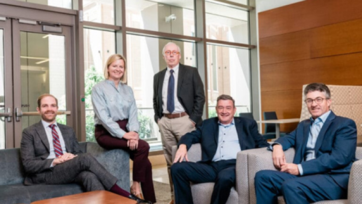 Blake R. Bauman with team