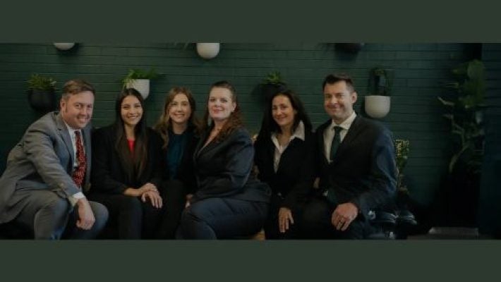 Bradley E. Smith with team