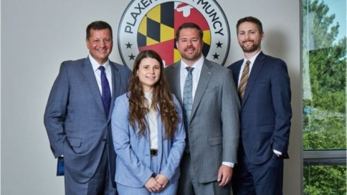 Bruce M. Plaxen With Team