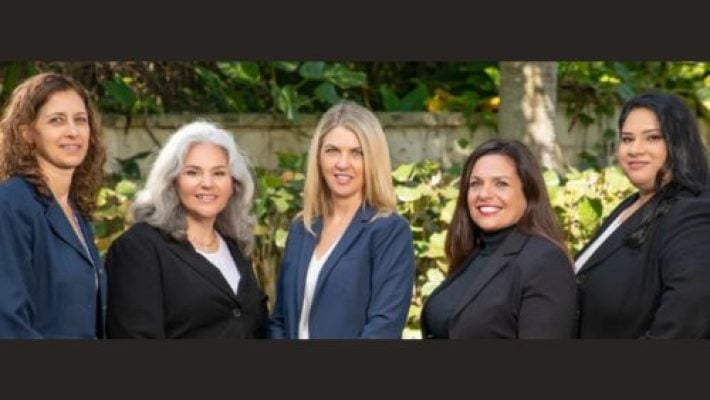Cathleen Scott with team