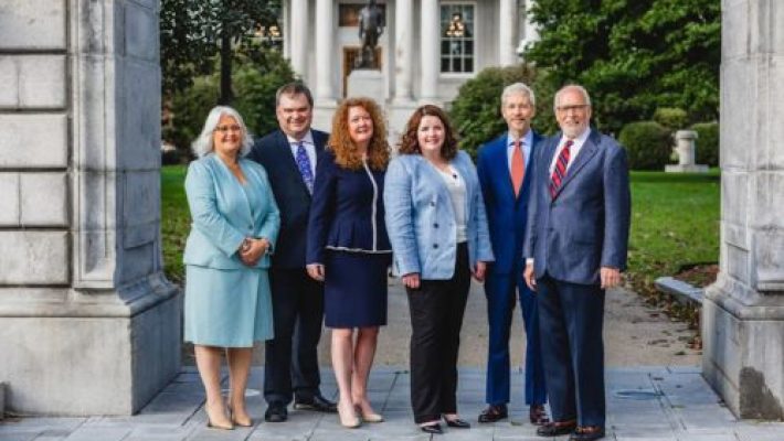 Charles G. Douglas III with team