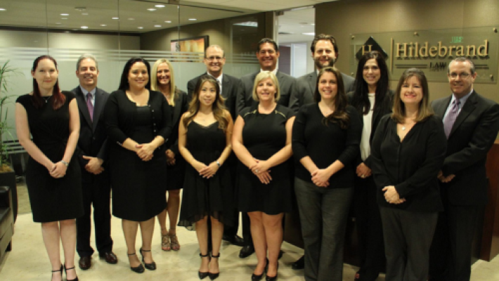 Chris Hildebrand with team in law firm