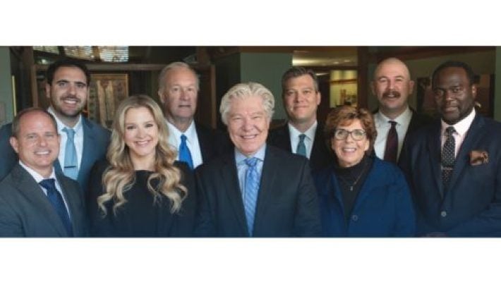 Clark O. Brewster with team