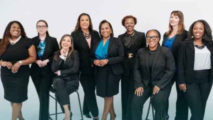 Conti Moore Smith with team