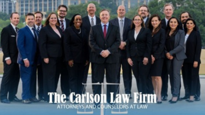 Craig W. Carlson with team
