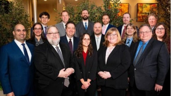 Daniel A. Parmele with team