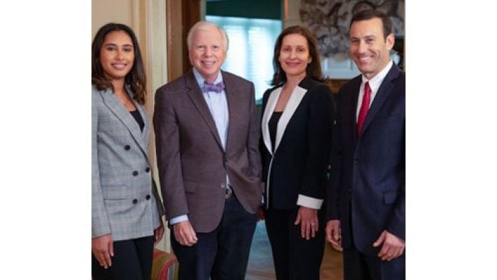 Edward S. Goodman with team
