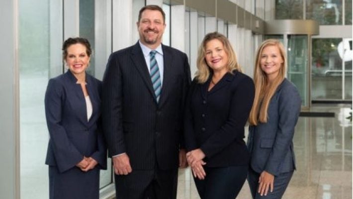 Gregory L. Deans with team