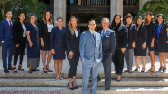 Gregory L. Ryan with his team