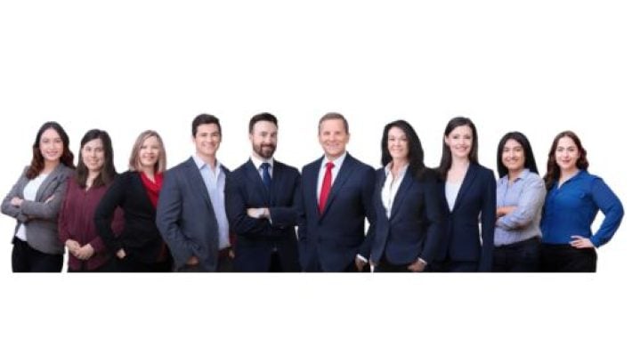 Herbert W. Auger with team