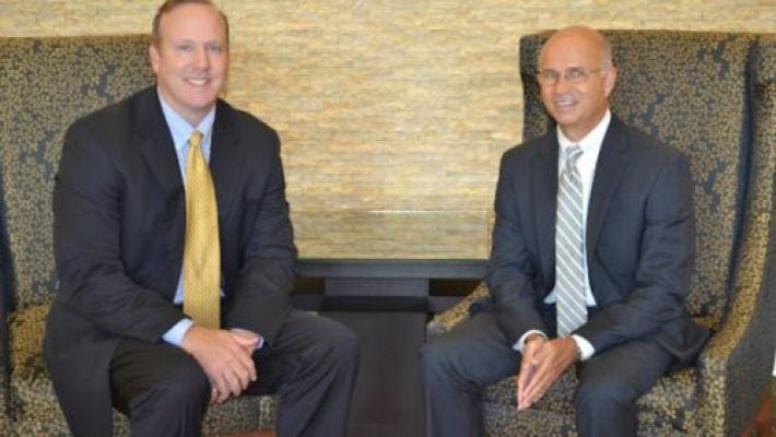 James W. Holmes With Partner