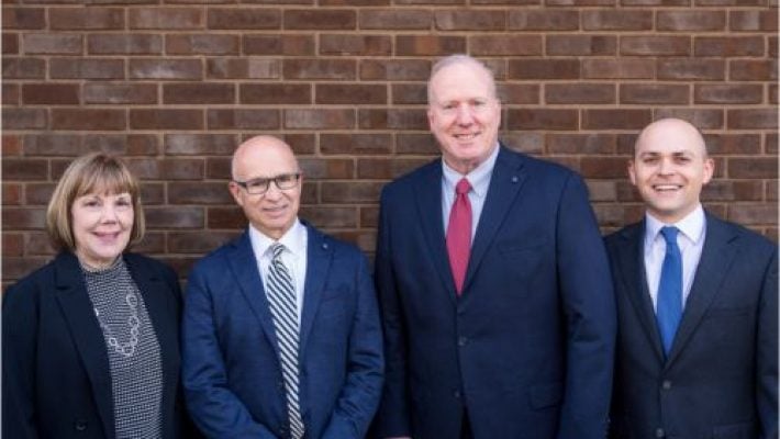 James W. Holmes With Team