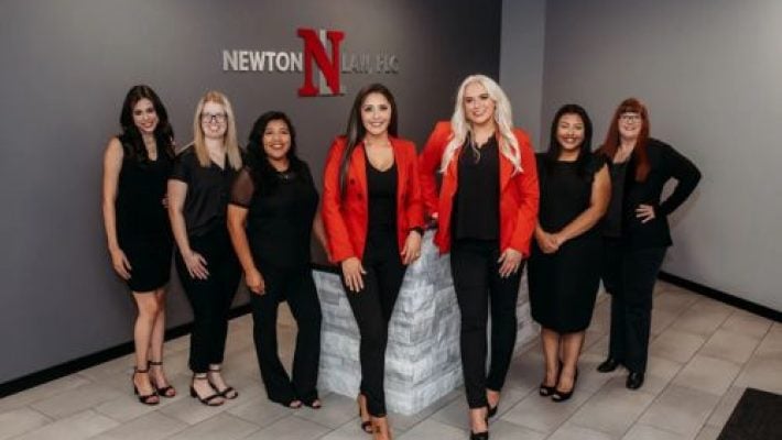 Jazmin E. Newton with team