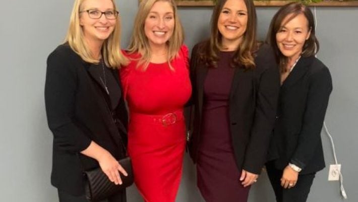 Jennifer L. Martinez with team