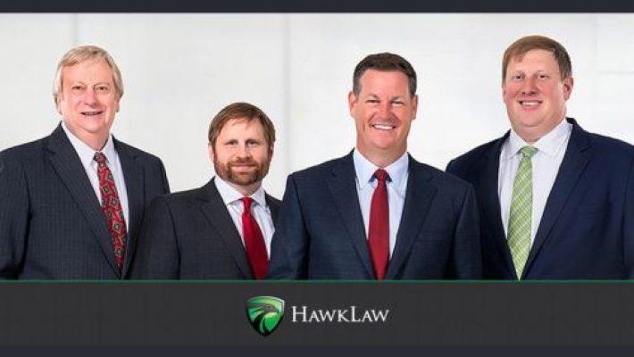 John D. Hawkins with team