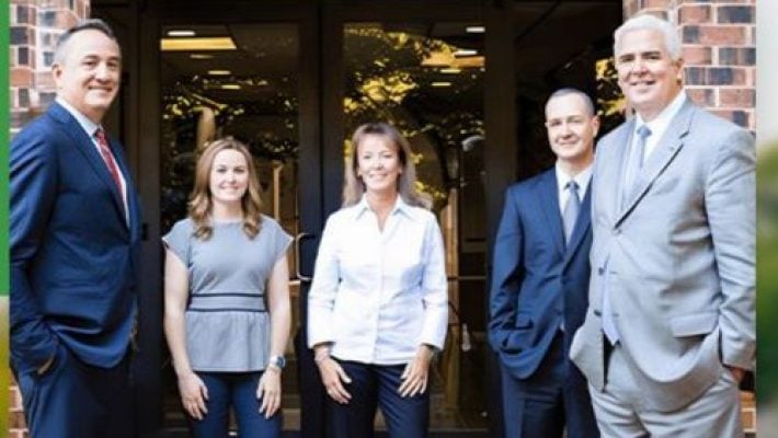 John F. Carroll with team