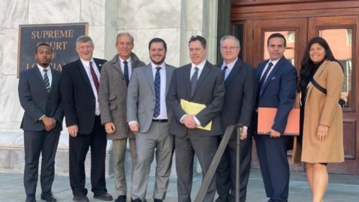 John W. Redmann with team