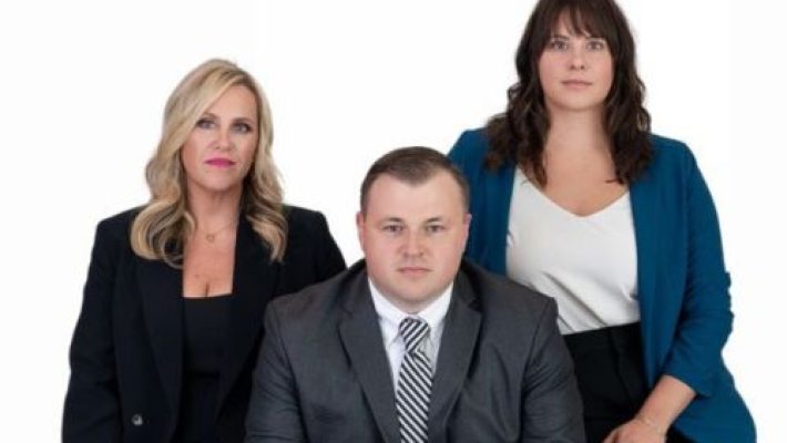 Justin M. Lovely with team