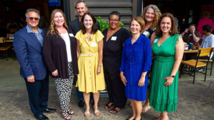 Lauren M. Hopwood with team