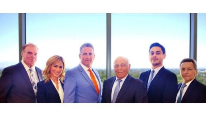 Leonard B. Levine with team