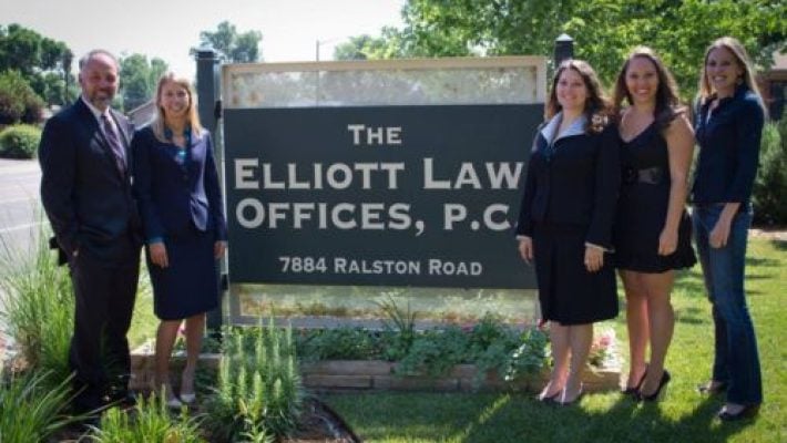 Mark D. Elliott with team