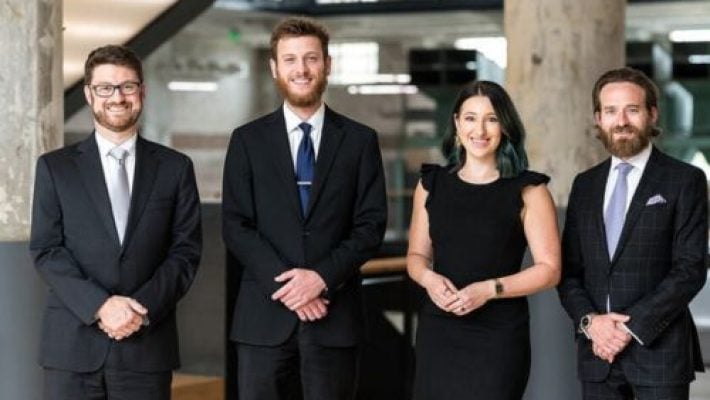 Mark S. McDaniel, Jr. with team