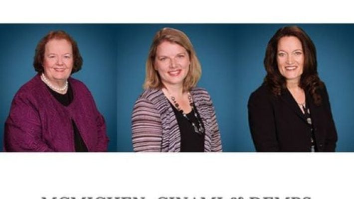 Melanie M. Demps with team