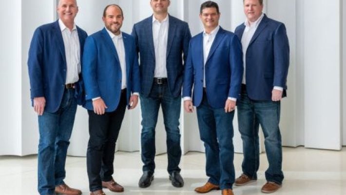 Michael L. Goldberg with team