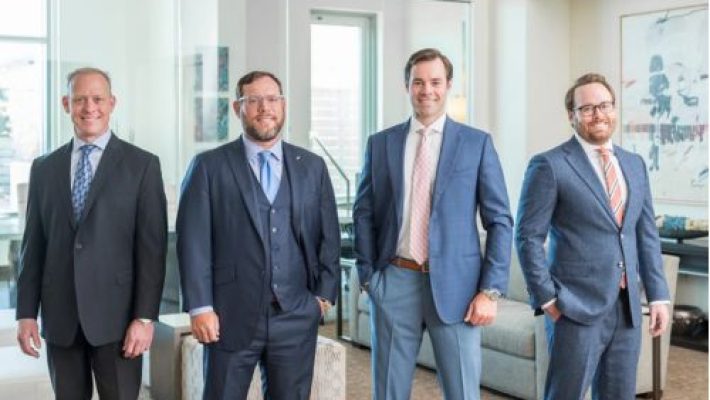 Michael P. Lyons with team