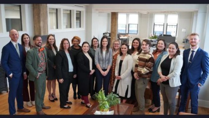 Miranda J. Mills with team