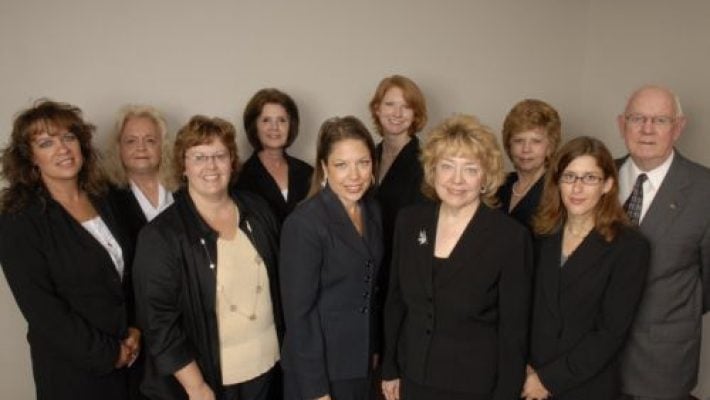 Nancy A. Roberson with team