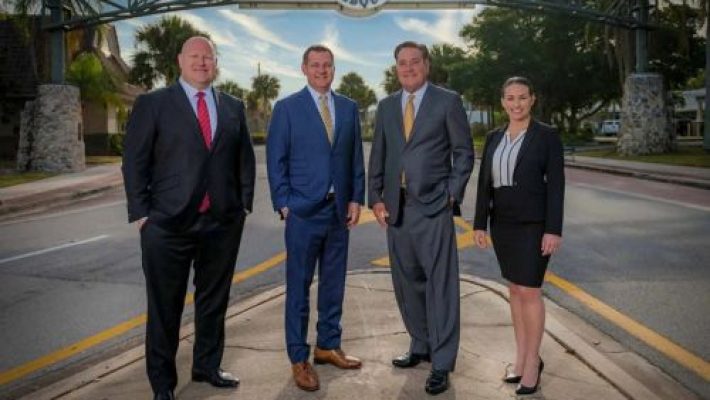 O. John Alpizar With Team