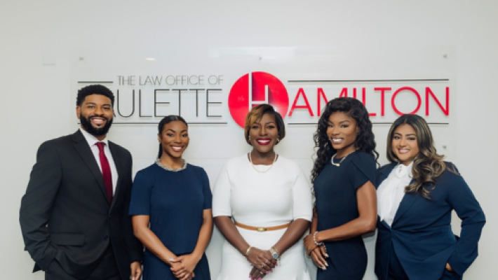 Paulette Hamilton with her team