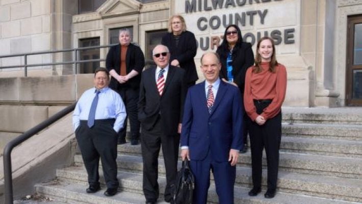 Rick D. Steinberg with team