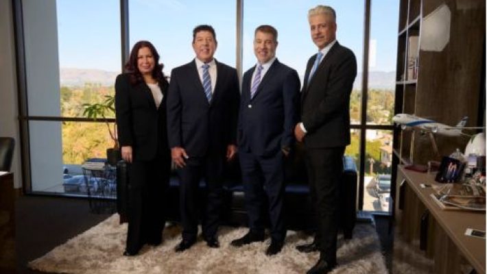 Ronald M. Binder with team