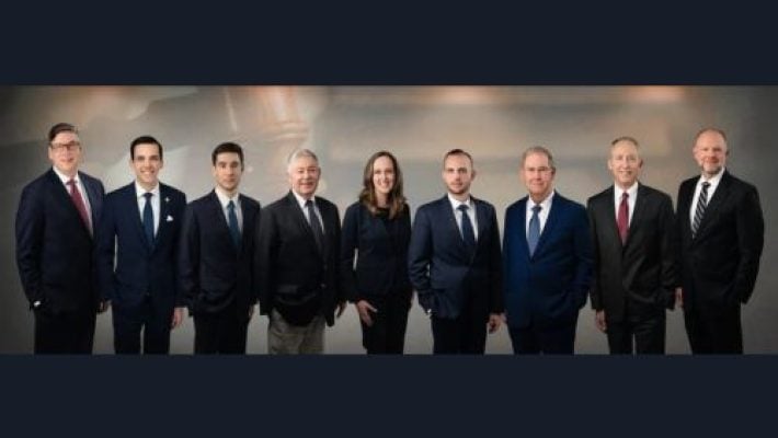 Russell W. Adkins with team