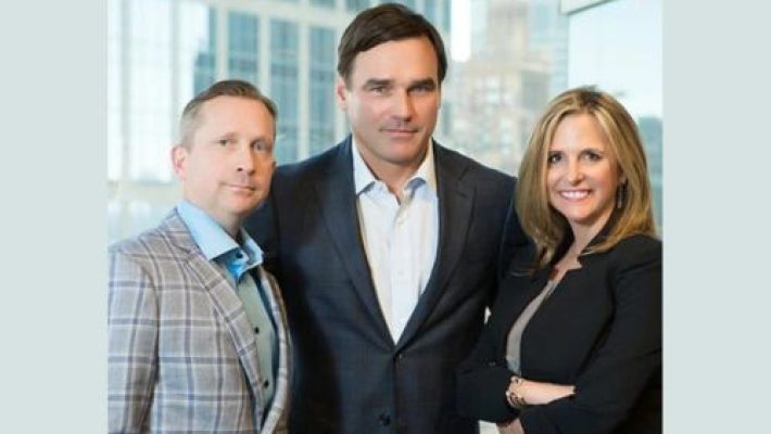 Scott A. Love with team