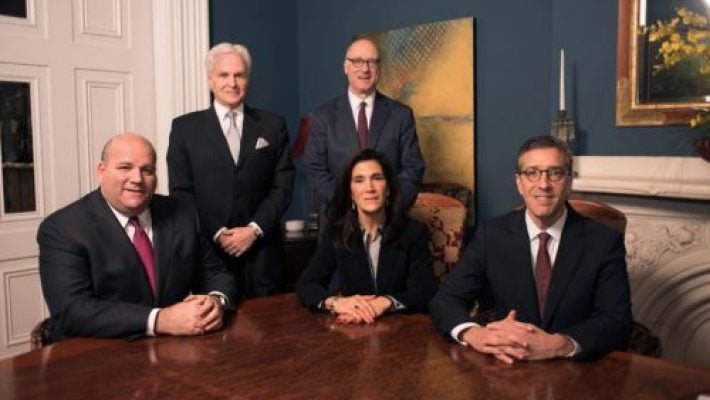 Stewart J. Eisenberg with team