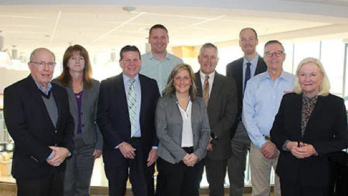 Suzanne Brunelle with team