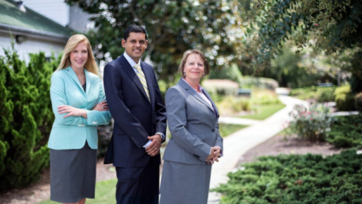 Suzanne T. Prescott with her team